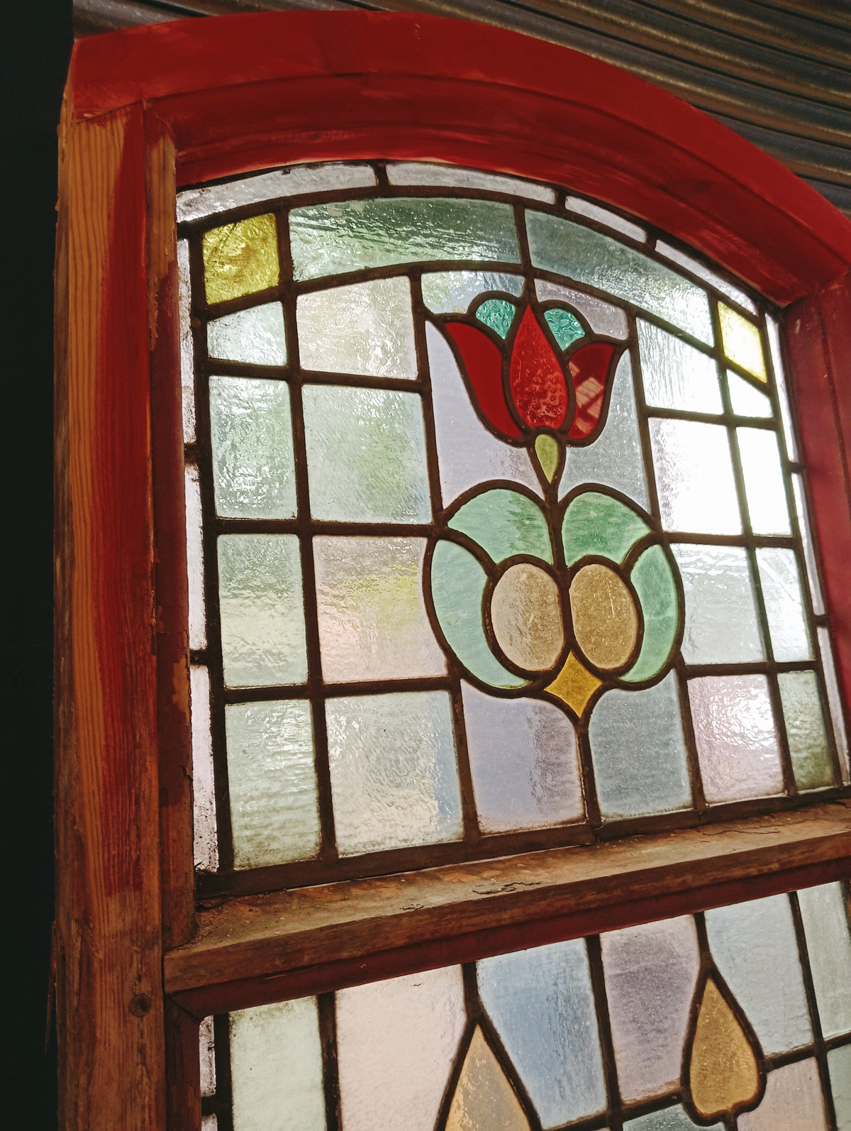 Pair of Large Reclaimed Arched Stained Glass Windows with Red Tulip Design