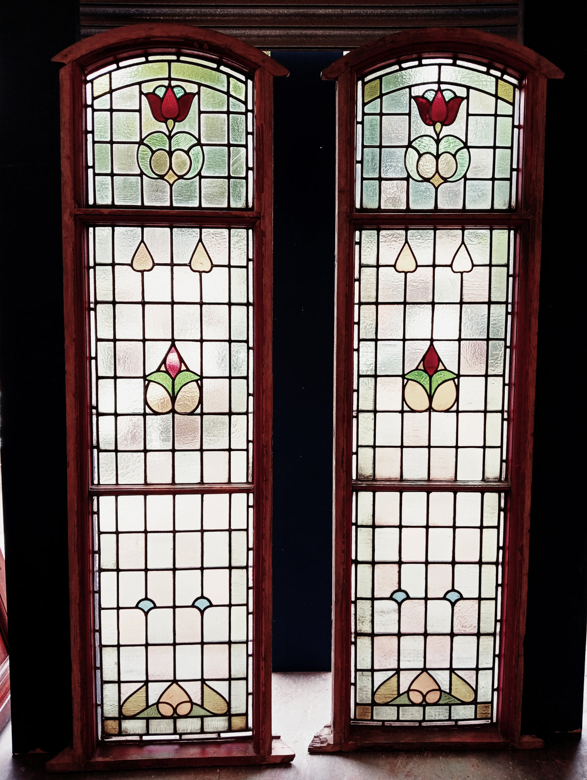 Pair of Large Reclaimed Arched Stained Glass Windows with Red Tulip Design
