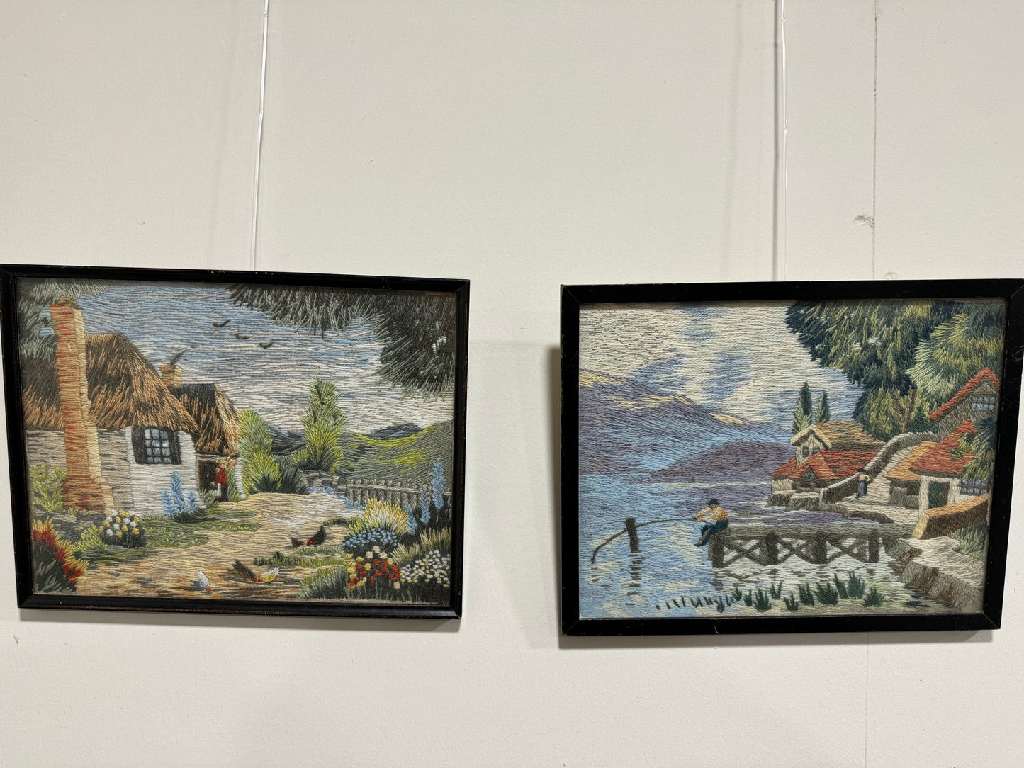 Pair of black frame woven pictures