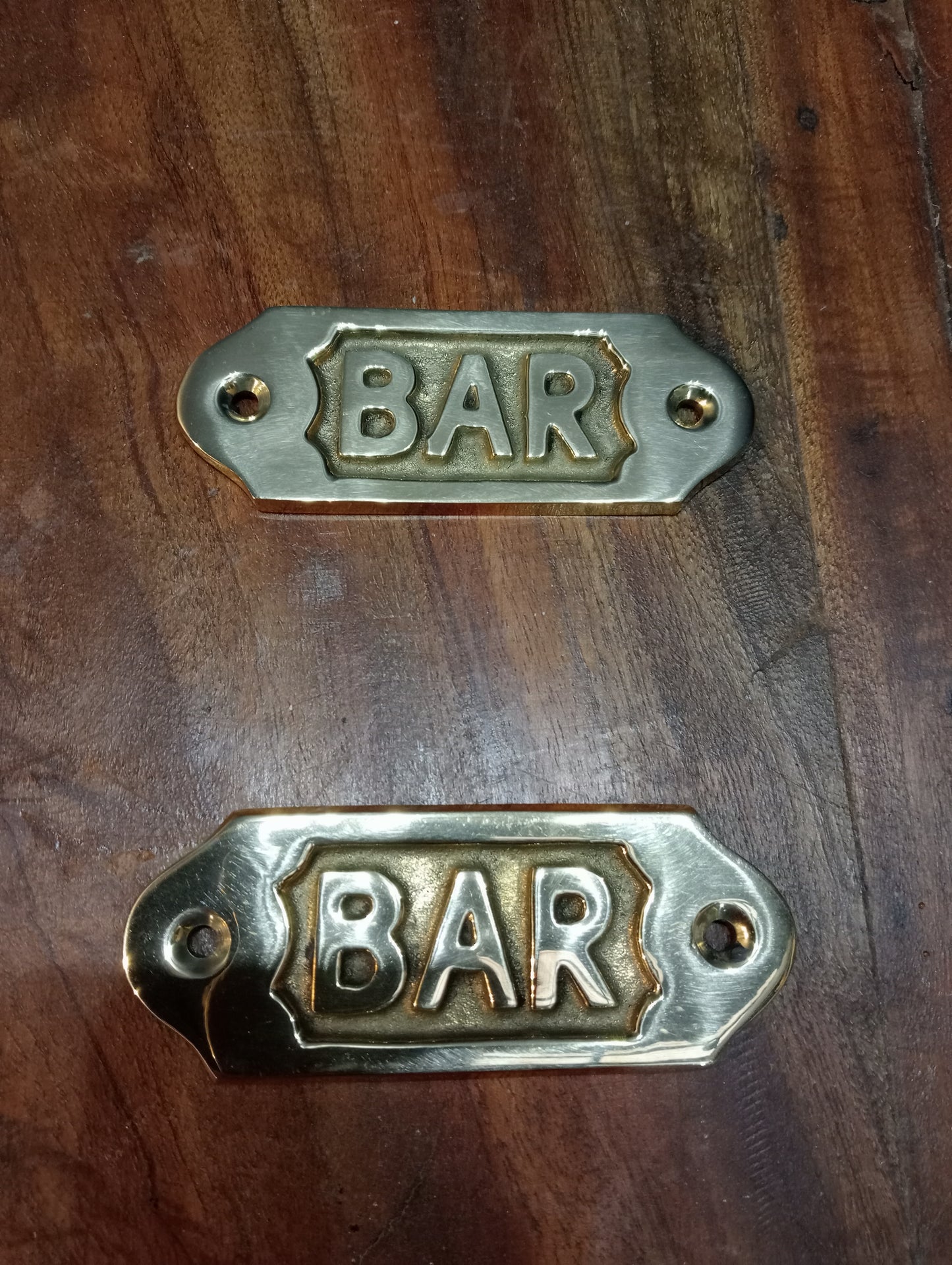 Pair of brass bar signs