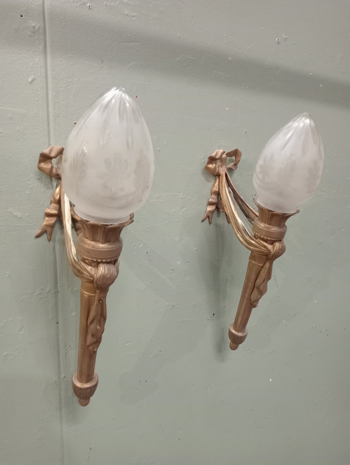 Pair of brass torchiere wall lights circa 1930 with swag design