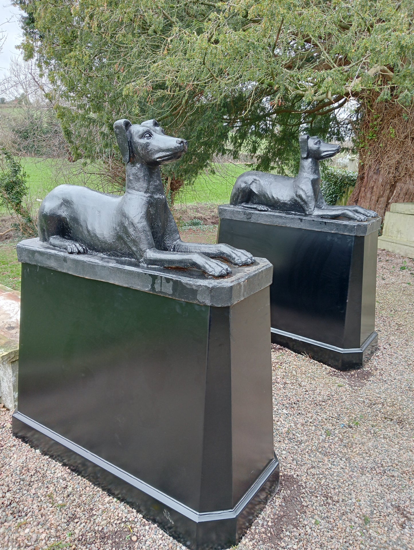 Pair of cast iron dogs and bases