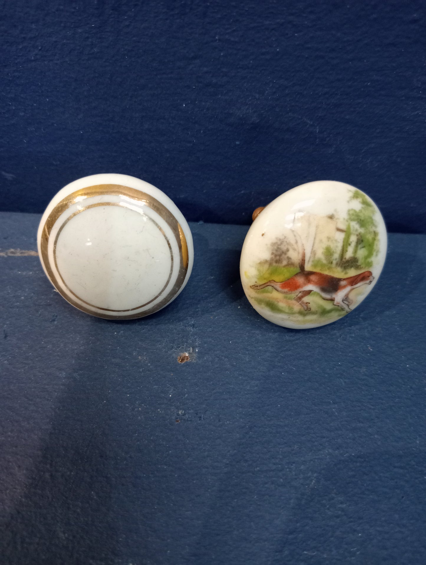 Pair of ceramic door knobs with dog