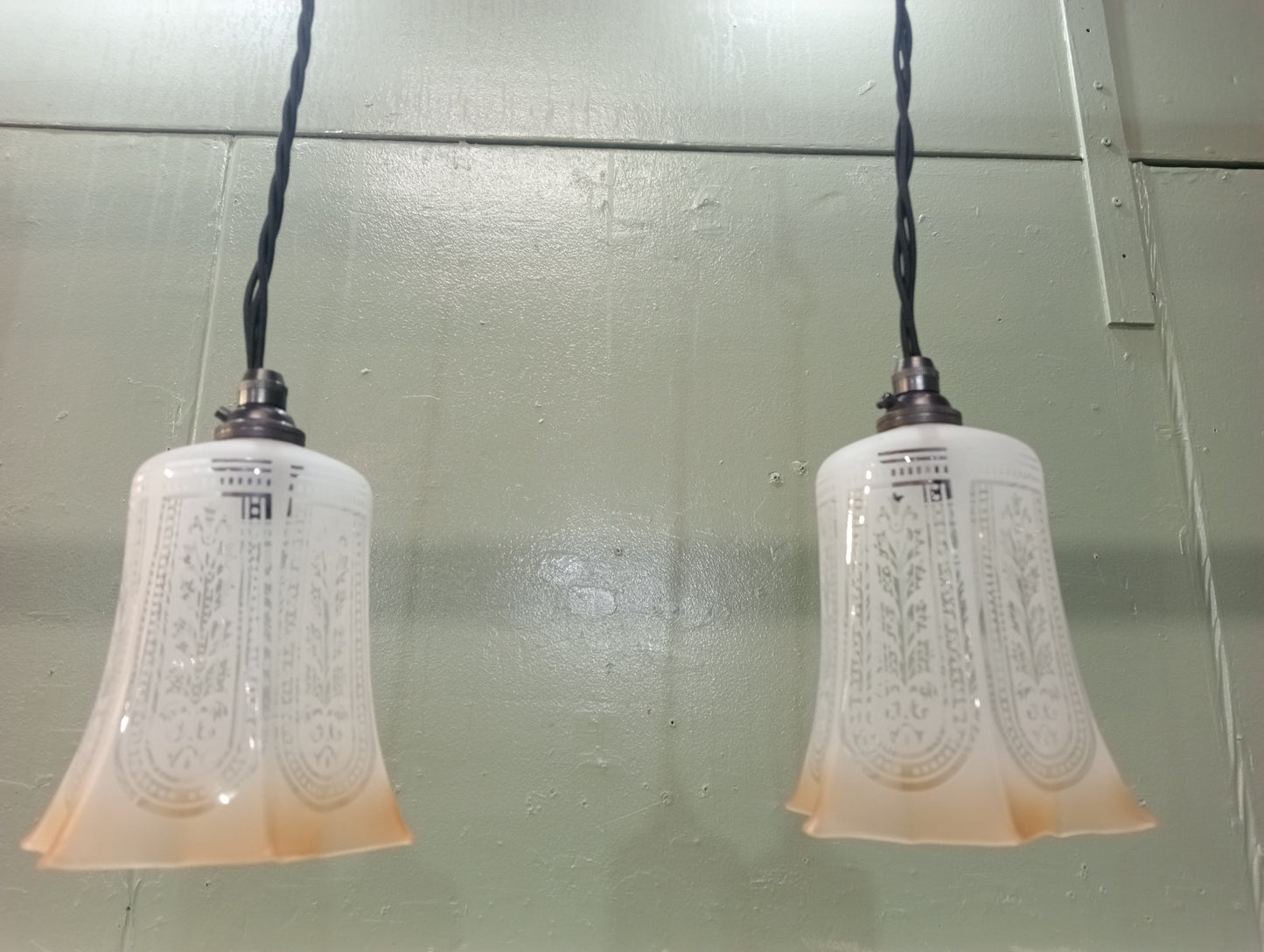 Pair of etched glass lights with bronze light fittings