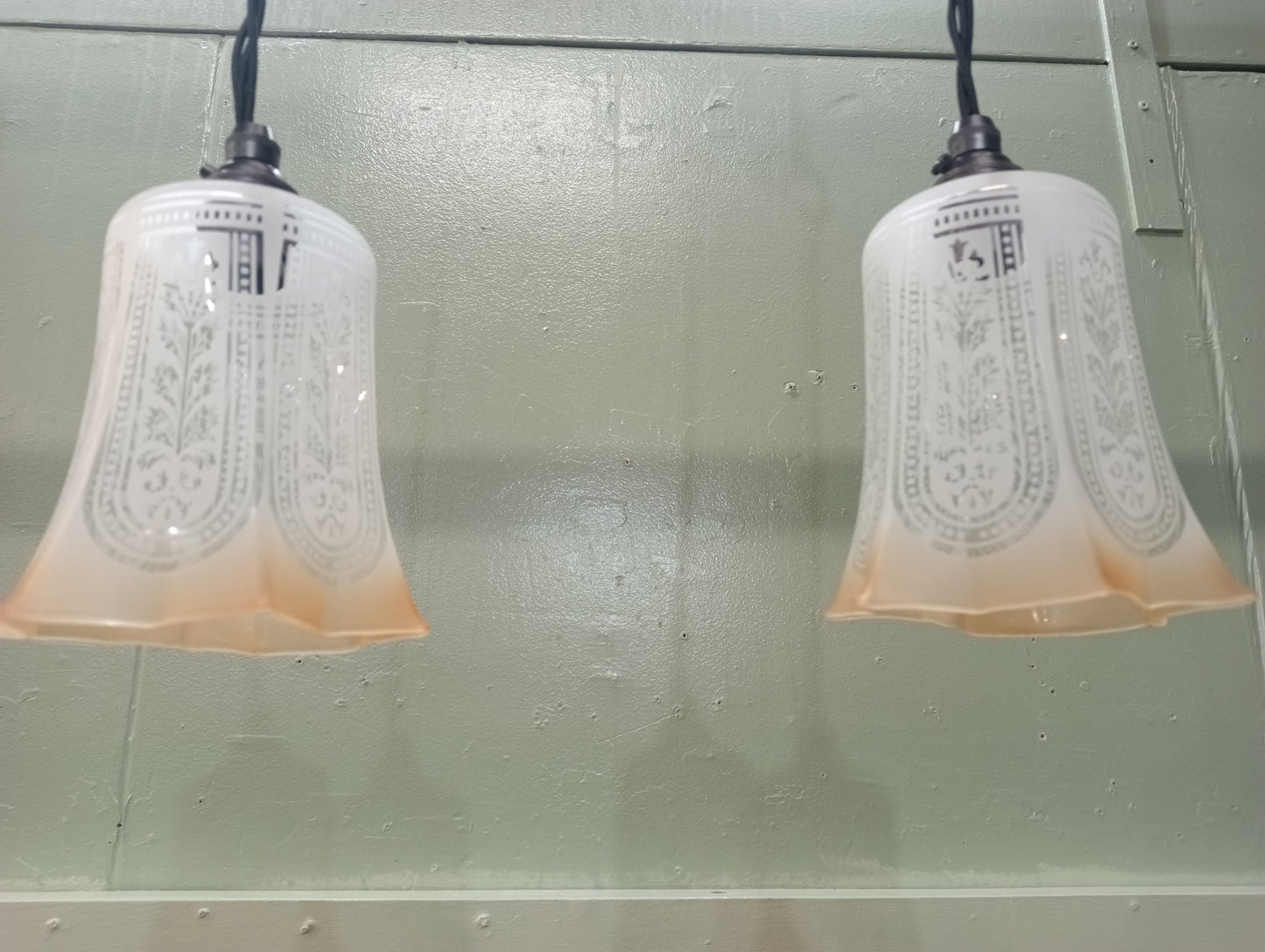 Pair of etched glass lights with bronze light fittings