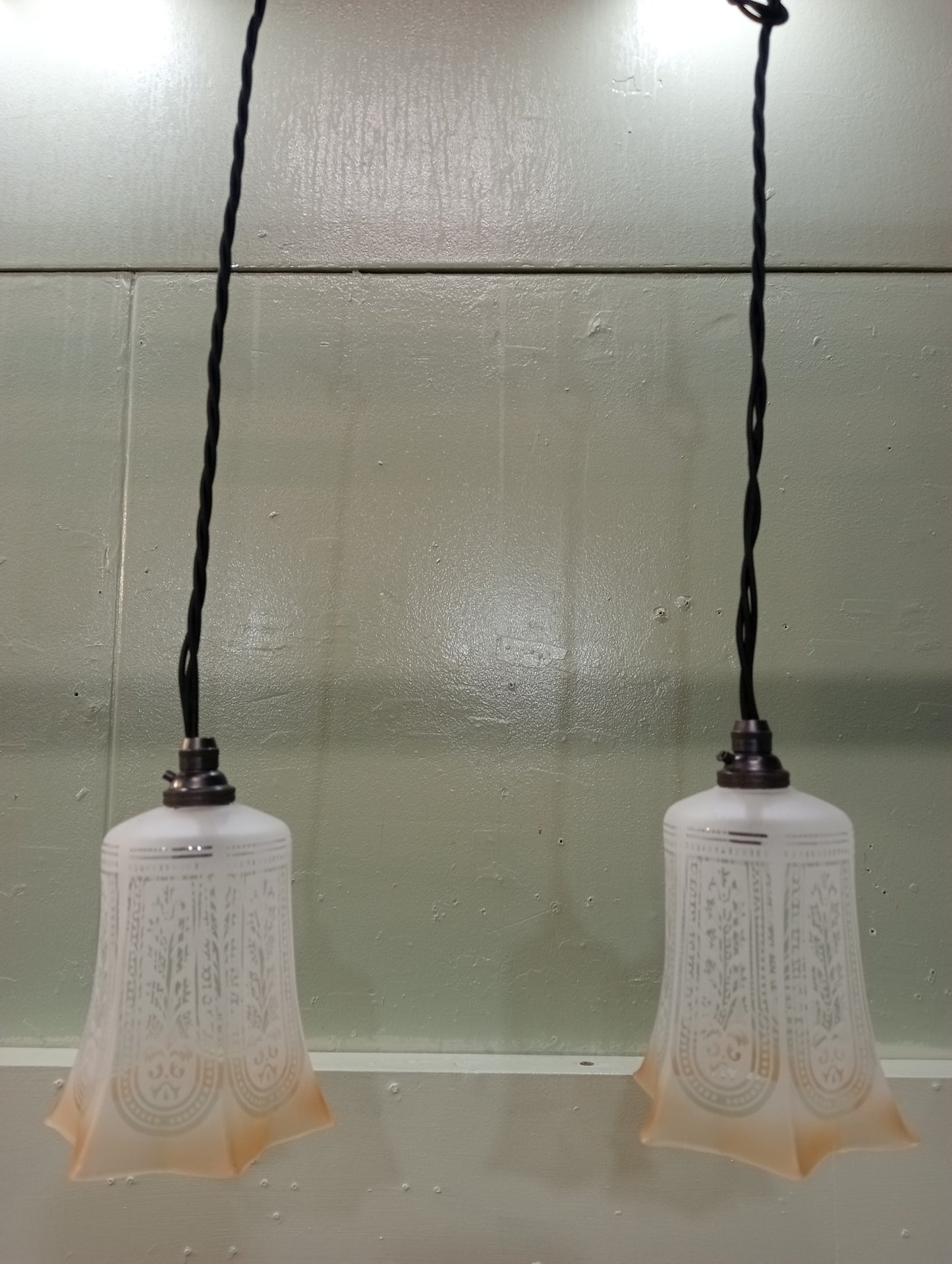 Pair of etched glass lights with bronze light fittings