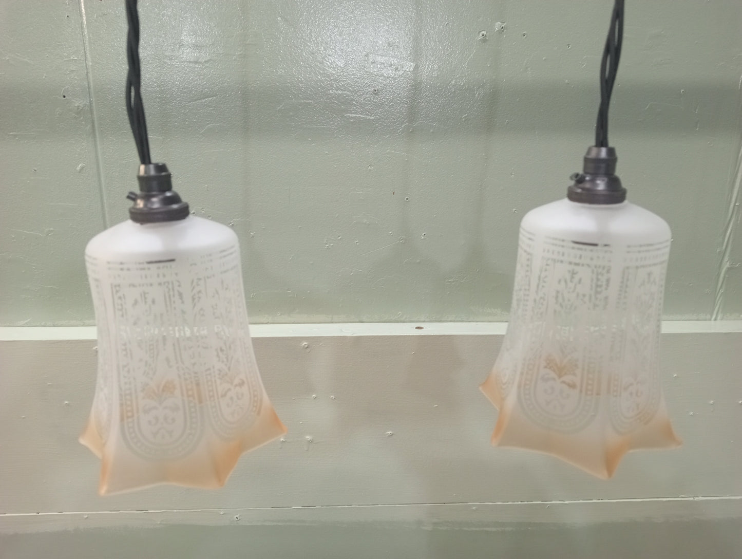 Pair of etched glass lights with bronze light fittings