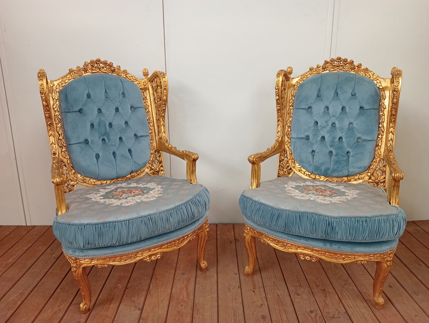 Pair of giltwood French style armchairs deep button floral design blue velvet fabric