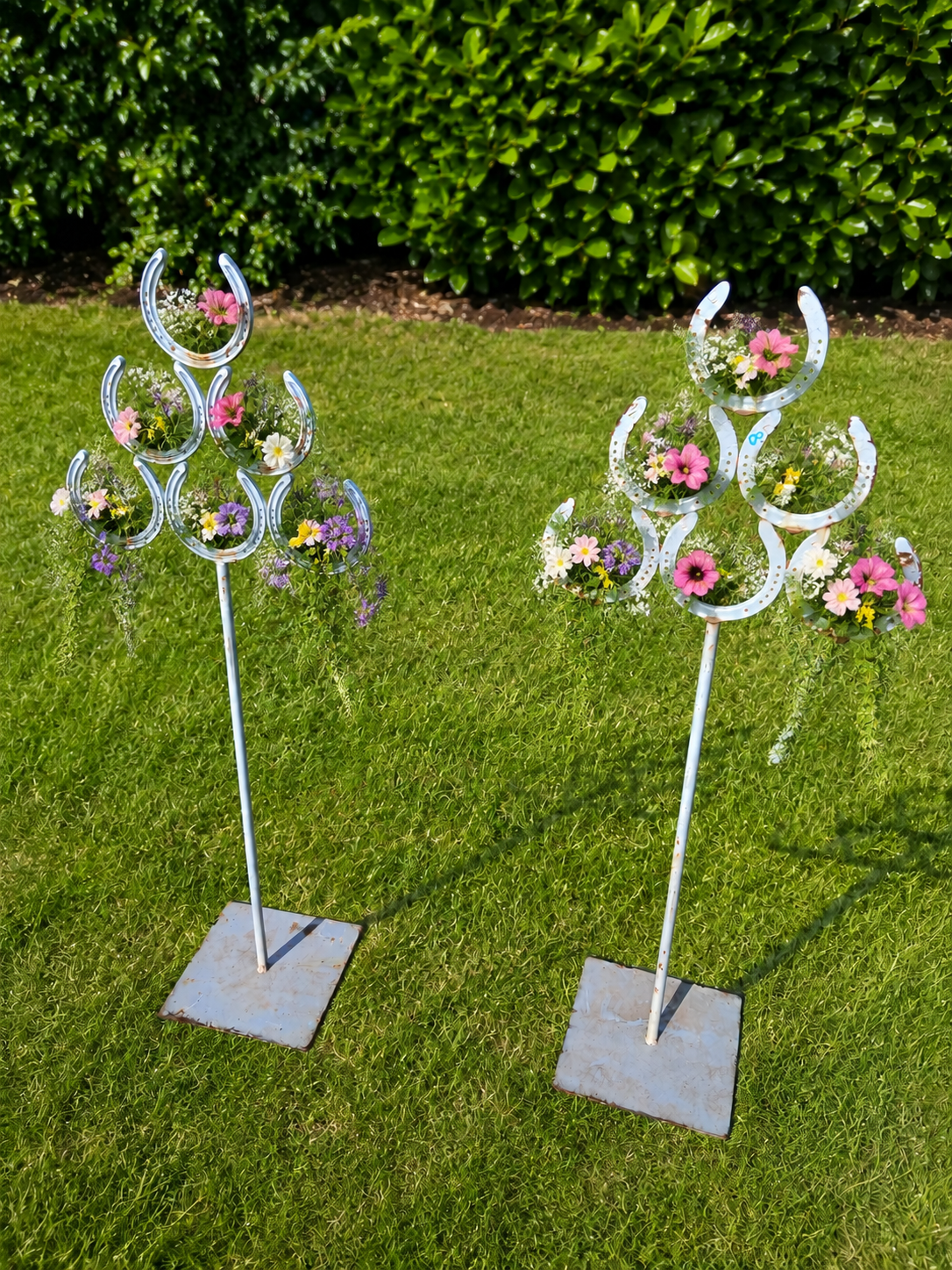 Pair of horse shoe flower holders