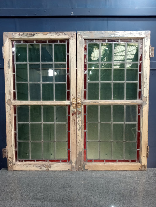 Pair of leaded stain glass windows with brass locks