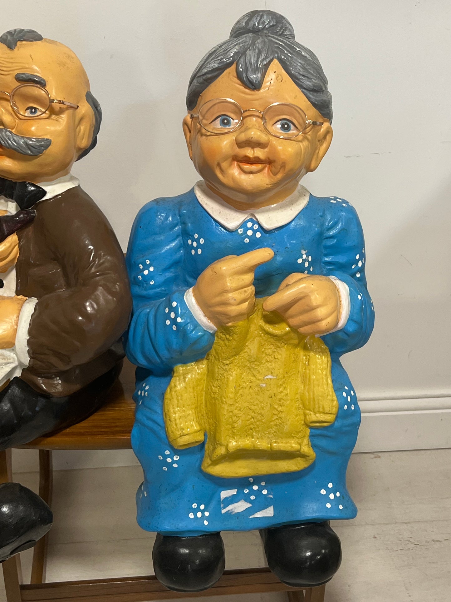 Pair of old couple resin figures