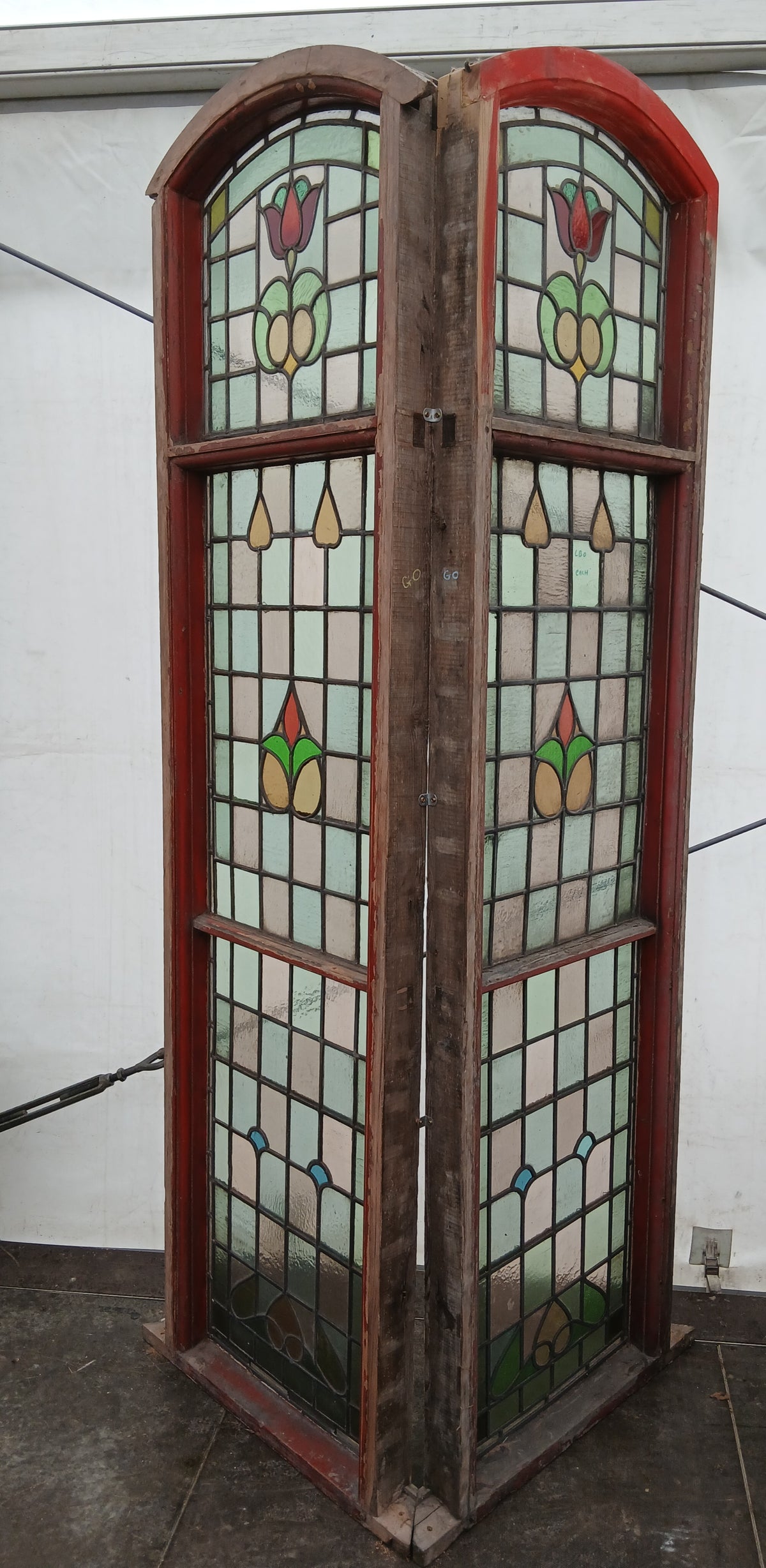 Pair of Large Reclaimed Arched Stained Glass Windows with Red Tulip Design