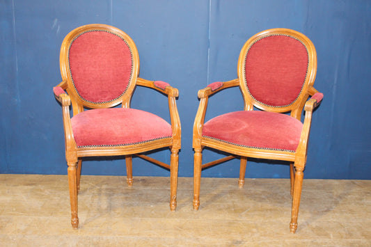 Pair of red draylon round back Louie carvers