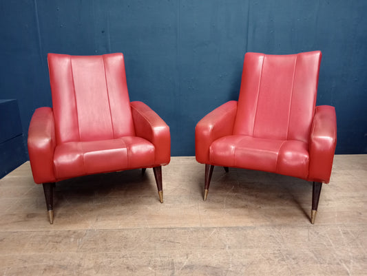 Pair of red leather retro armchairs with brass cupped legs