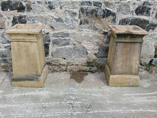 Pair of sandstone chinmey pots