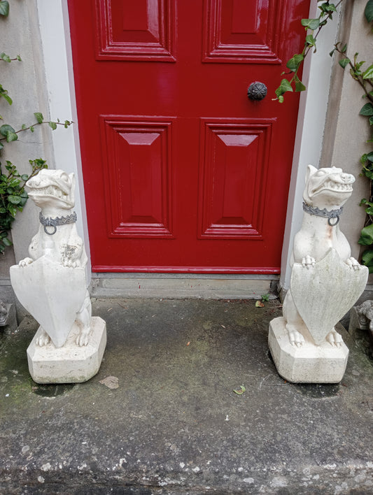 Pair of stone dogs with lead collar