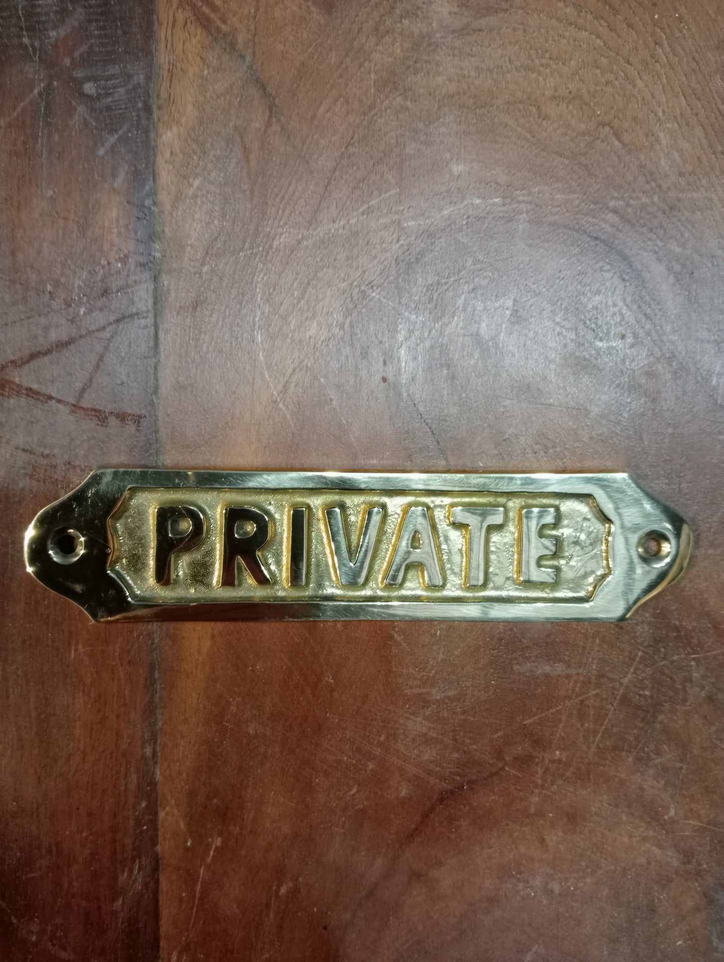 Private brass sign