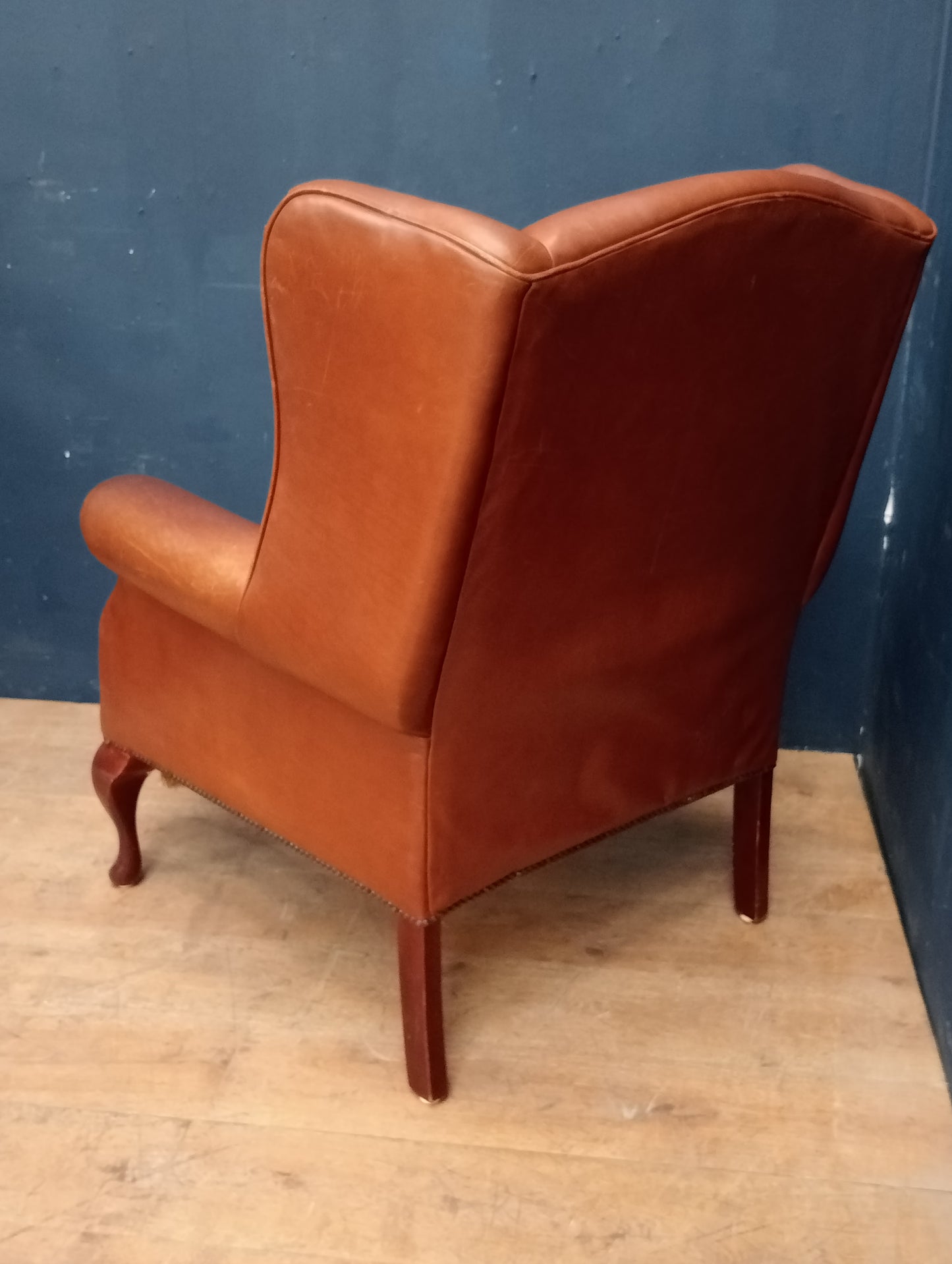 Queen Ann leather wingback chair