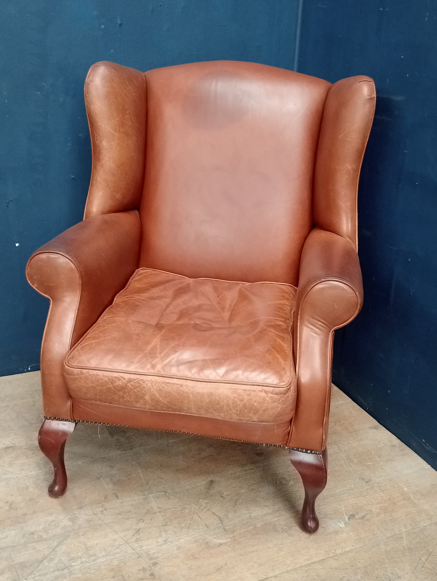 Queen Ann leather wingback chair