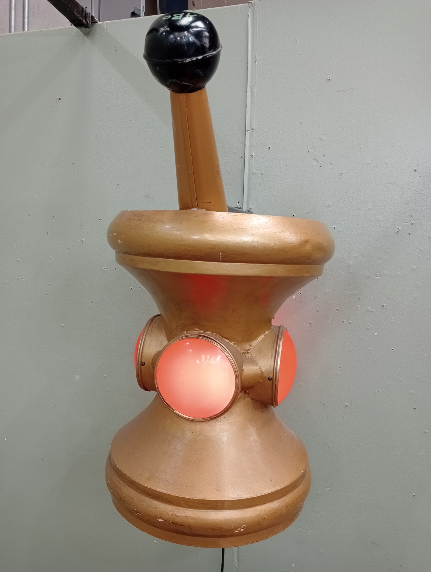 Rare early 20th C Pharmacy Trade Sign in the form of a mortar and pestle .In working order. Gilded colour with red lenses on 4 sides.