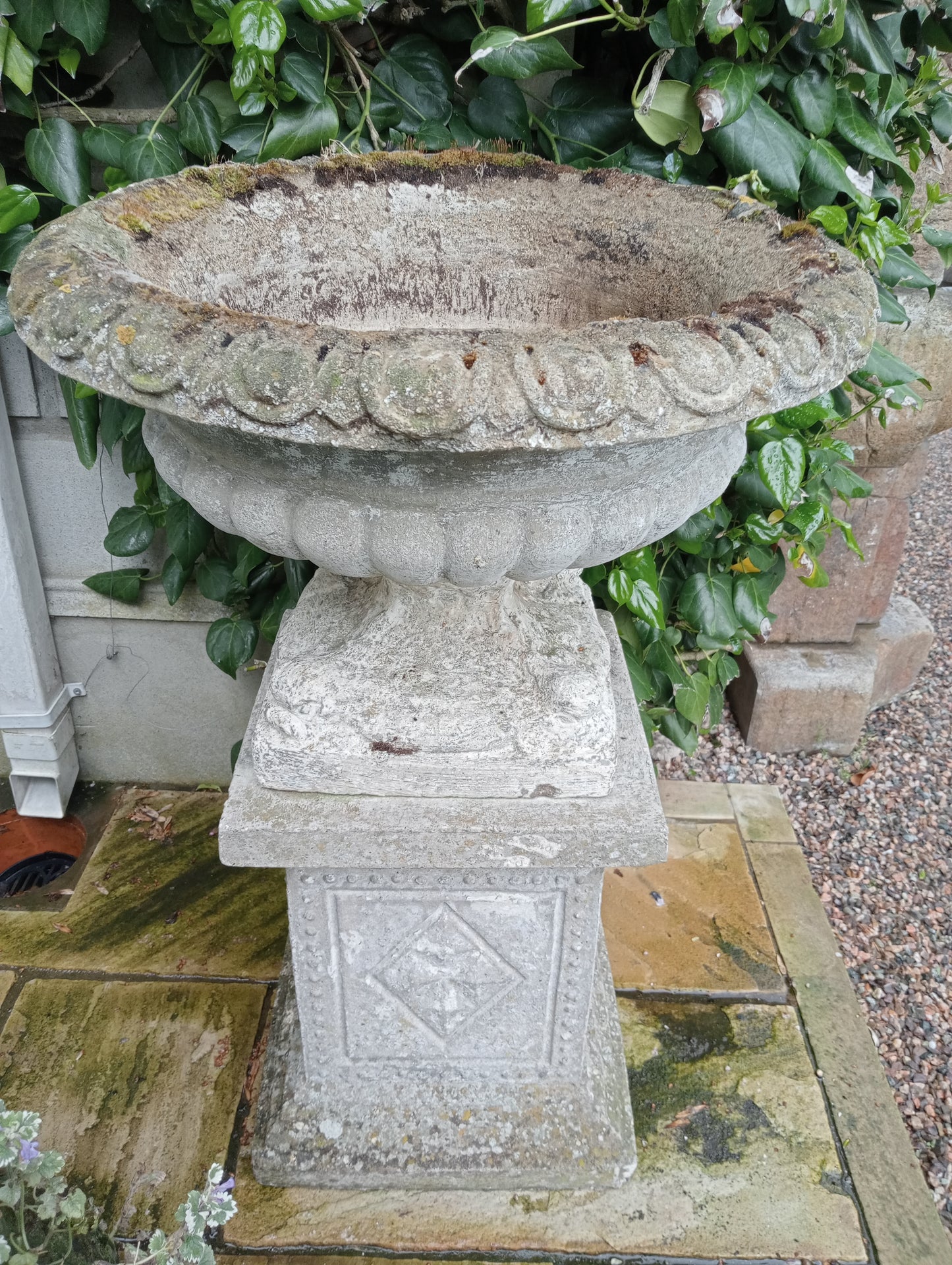 Stone urn on plinth