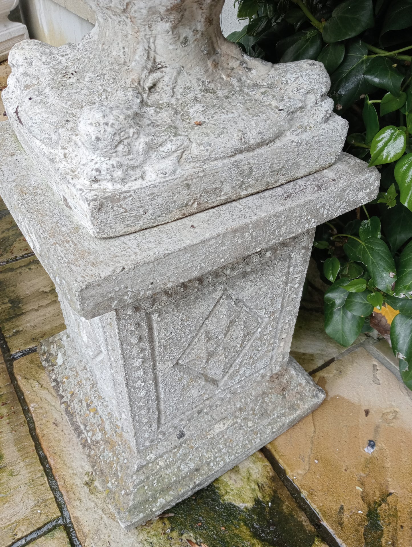 Stone urn on plinth