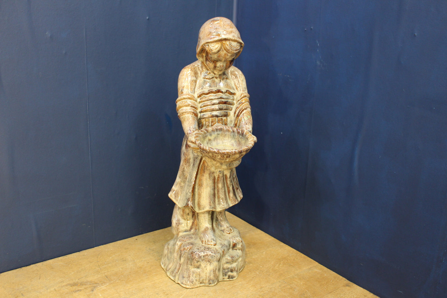 Terracotta glazed girl holding bowl