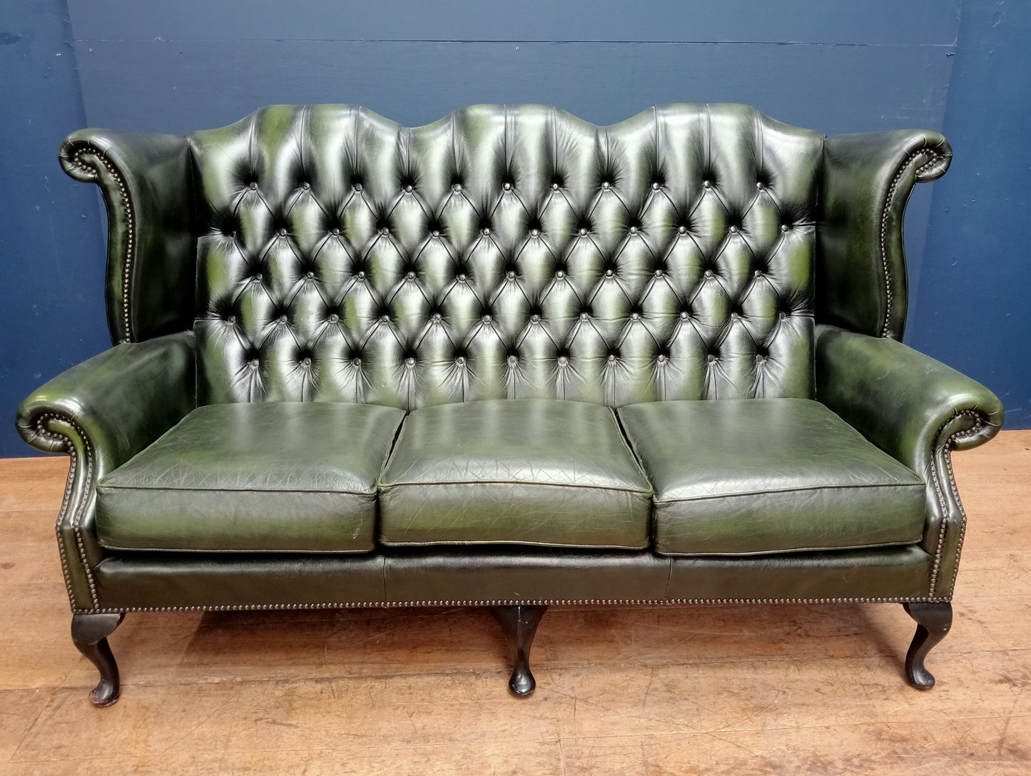 Three seater deep button wingback sofa