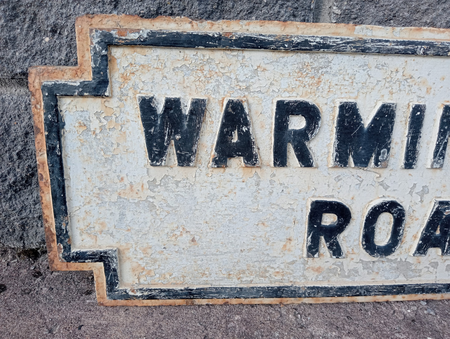 Warmington road cast iron street sign