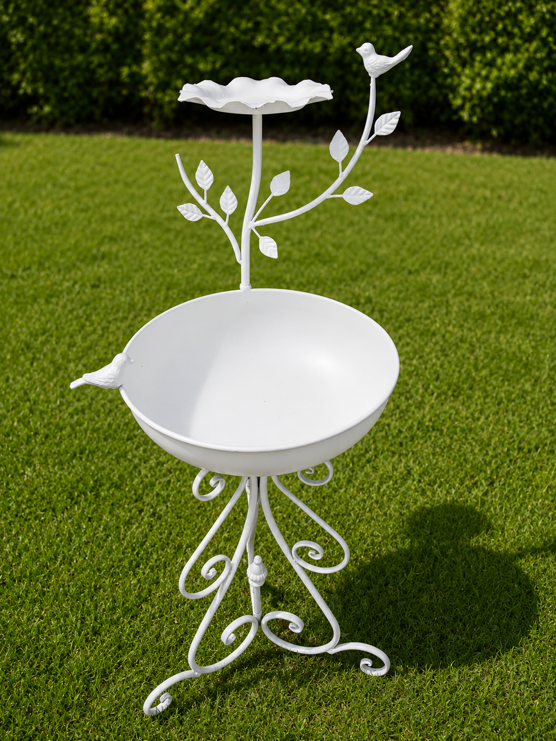 Wrought white iron birdbath with birds